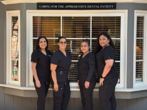 Image of the staff in front of the clinic
