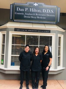 Image of the staff in front of the clinic